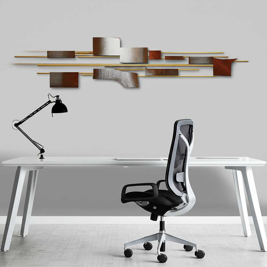 A modern home office with an inspiring abstract metal art piece on the wall behind the desk.