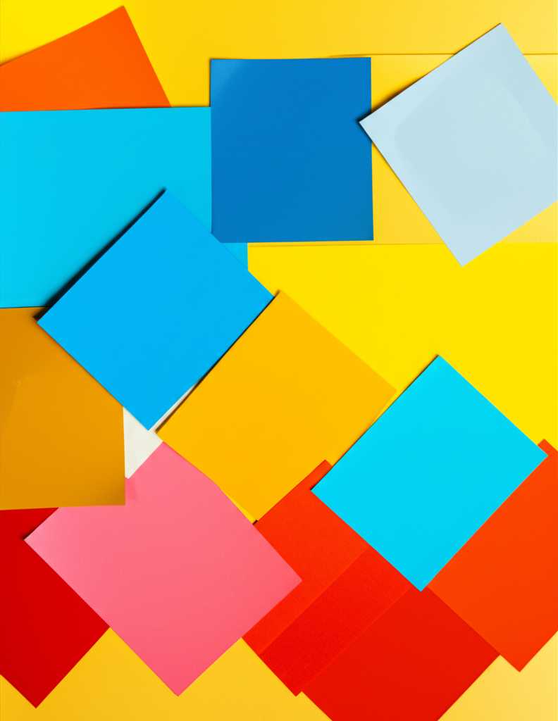 A mood board showcasing color swatches (blues, greens, yellows, reds) alongside small examples of abstract art on metallic-looking squares, demonstrating color theory in art selection.
