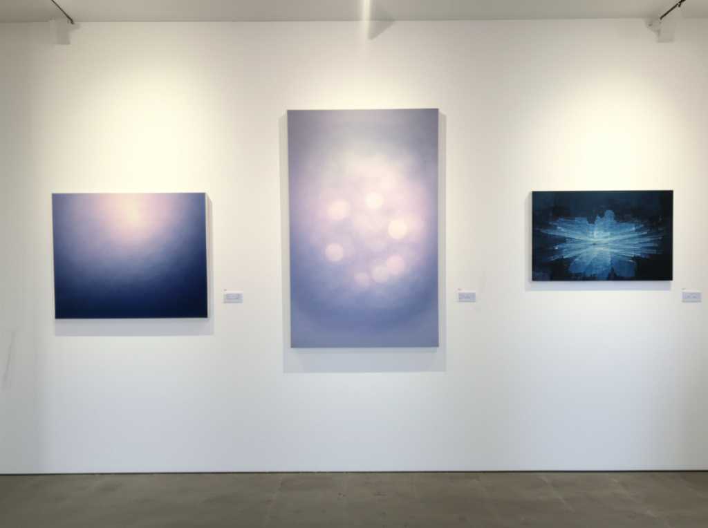 A stylized, modern gallery wall concept featuring various abstract representations of different art styles (e.g., Impressionistic light patterns, bold abstract shapes, graphic Pop Art elements) on sleek, metallic-looking panels. Subtle lighting highlights varying textures and gloss levels.