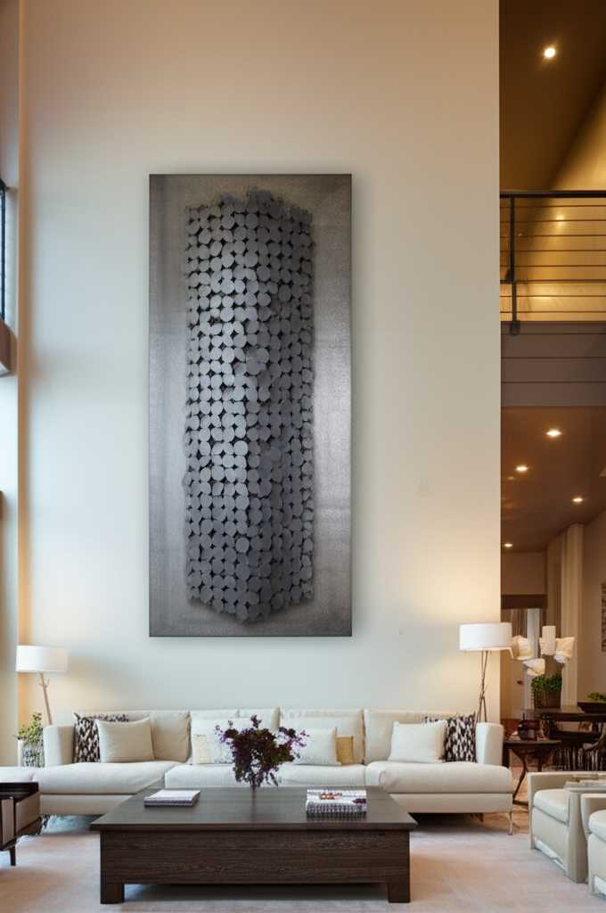 A large metal art piece hung strategically high on a tall living room wall, creating a dramatic effect.