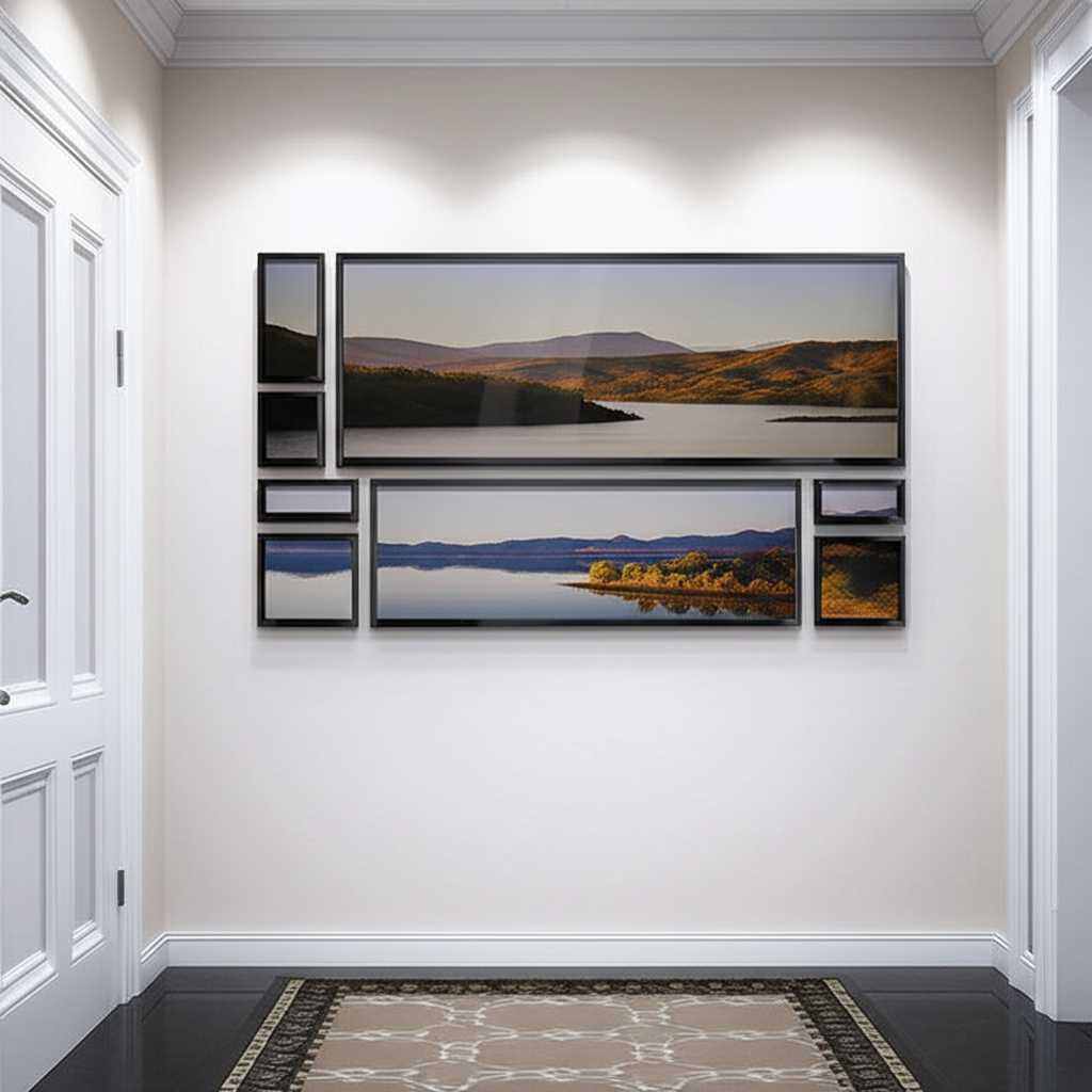 A stylishly arranged gallery wall of different-sized rectangular metal prints in a modern hallway, showcasing both symmetry and asymmetry.